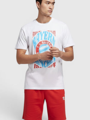 FTFO || BIG BRAND LOW PRICE model wearing a white Adidas FC Bayern Munich graphic cotton crewneck t-shirt