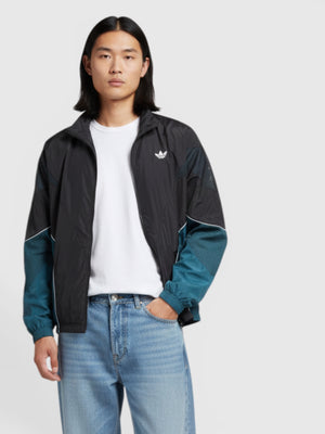 FTFO || BIG BRAND LOW PRICE Adidas Cutline track top in black and teal with full zip and ribbed cuffs on a model.
