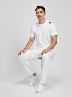 FTFO || BIG BRAND LOW PRICE Adidas white short-sleeve compression training t-shirt worn by a male model.