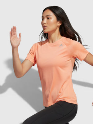FTFO || BIG BRAND LOW PRICE Adidas Adizero peach running tee on a female runner wearing black leggings