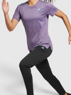 FTFO || BIG BRAND LOW PRICE Adidas Adizero purple running tee on a female runner with black pants and headband