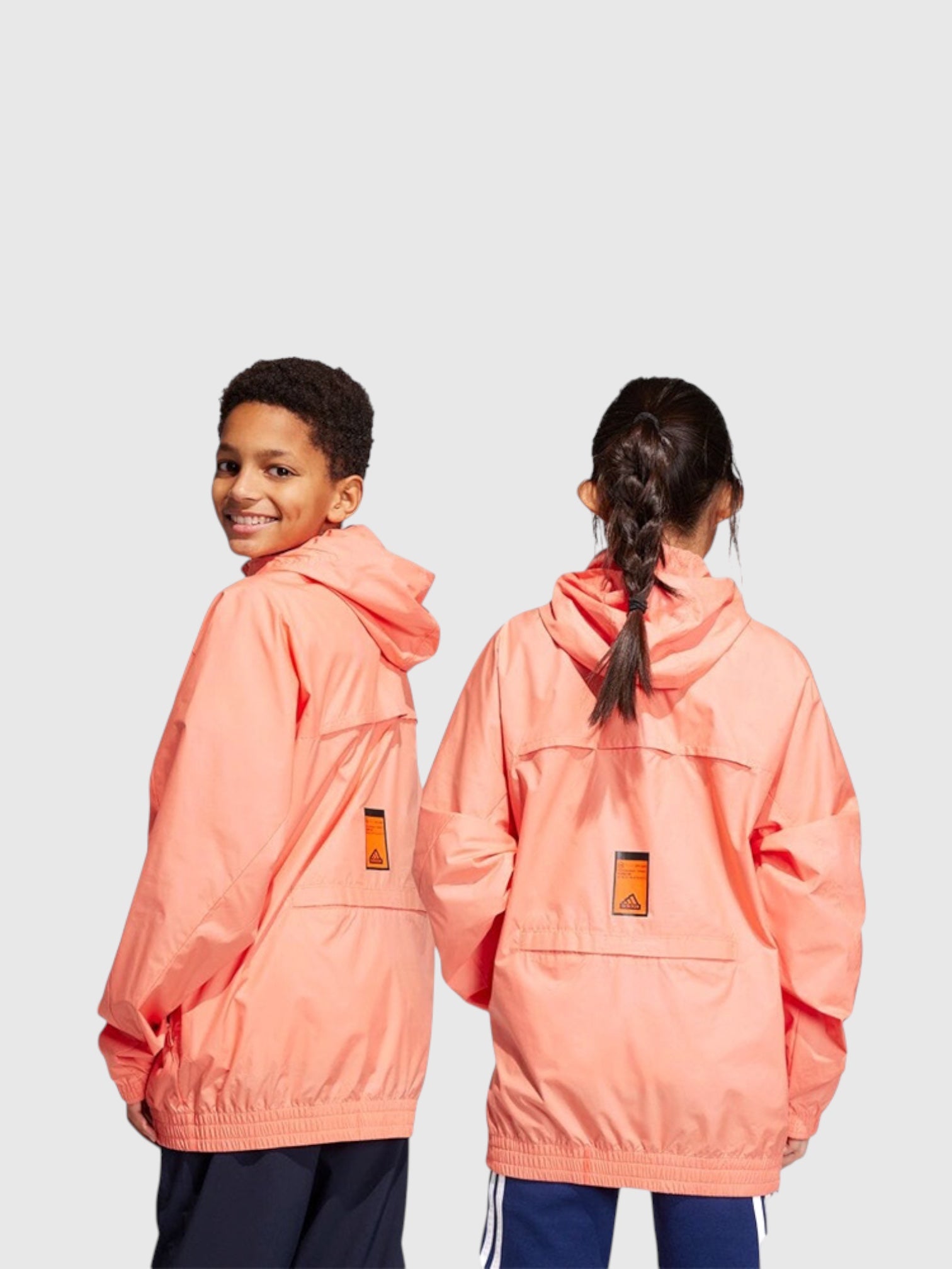 FTFO || BIG BRAND LOW PRICE juniors wearing coral pink Adidas City Escape packable windbreaker jackets with hoods
