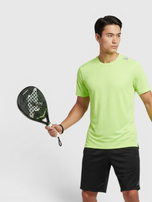 FTFO || BIG BRAND LOW PRICE model wearing a lime green Adidas HEAT.RDY slim fit HIIT training t-shirt with black shorts
