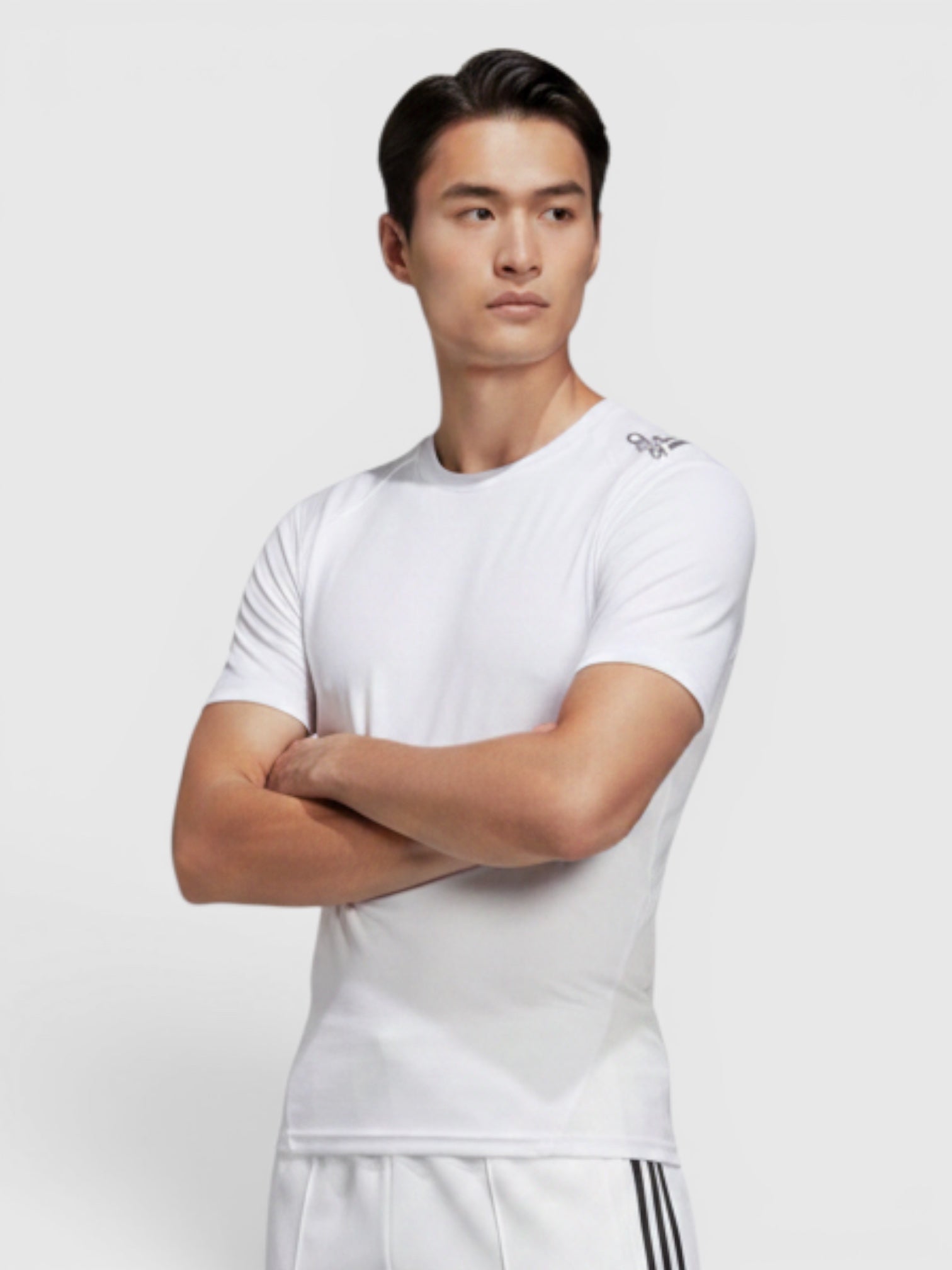 FTFO || BIG BRAND LOW PRICE Adidas white Alphaskin compression training t-shirt worn by a male model