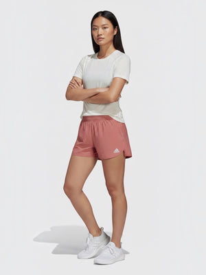 FTFO || BIG BRAND LOW PRICE Adidas XCITY running tee in white worn by a female model with pink shorts and sneakers