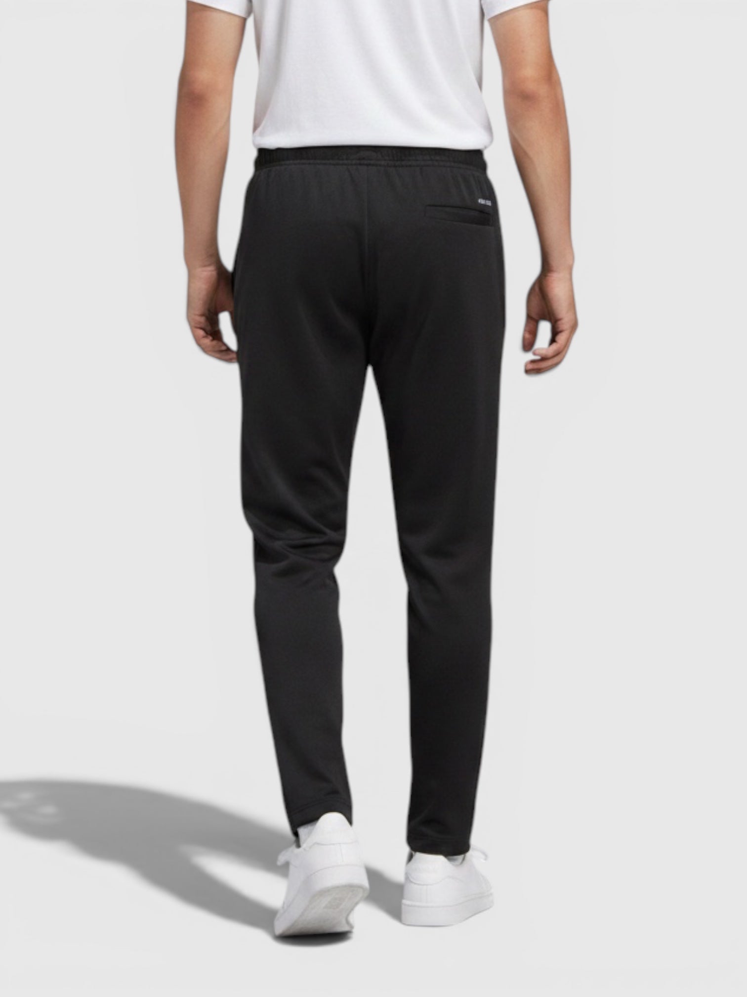 Tampilan belakang celana olahraga Adidas W Tiro berwarna hitam dengan potongan tapered dan pinggang elastis dari FTFO || BIG BRAND LOW PRICE