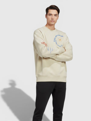 Model pria mengenakan sweatshirt Adidas by Stella McCartney FTFO || BIG BRAND LOW PRICE warna krem dengan grafis