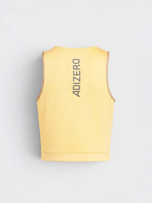 Back view of FTFO || BIG BRAND LOW PRICE Adidas Adizero yellow crop running tank top with reflective logo detail.